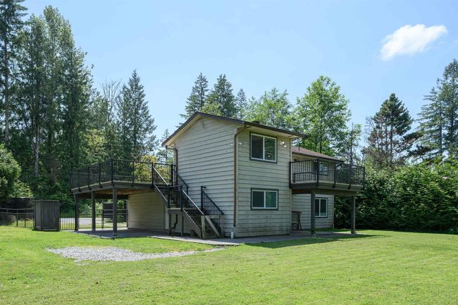 Back of property featuring a patio area, stairs, and a deck | Image 5