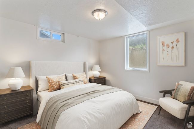 Bedroom featuring a textured ceiling and carpet | Image 31