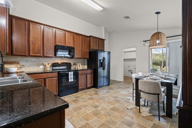 Spacious kitchen with plenty of counter space for prep | Image 10
