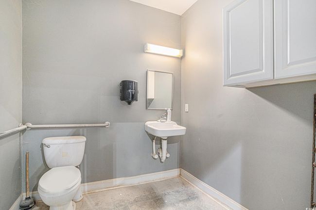 Bathroom featuring baseboards and toilet | Image 23