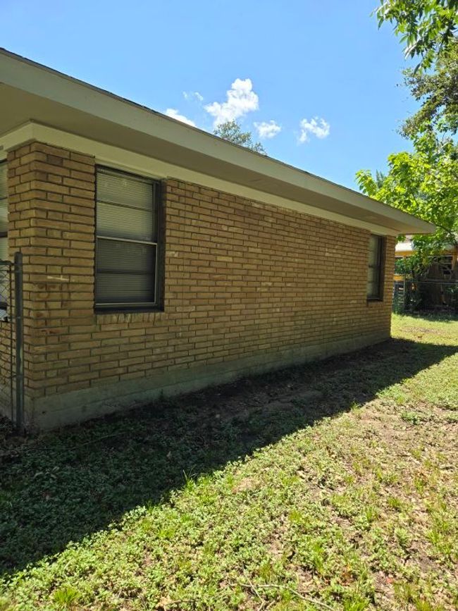 View of side of property with brick siding and a lawn | Image 5