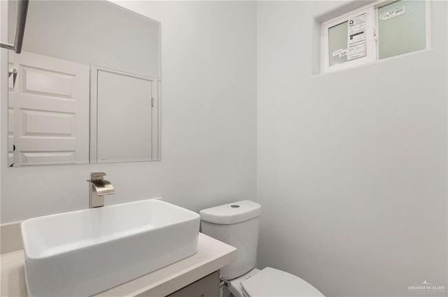 Half bathroom with vanity and toilet | Image 17
