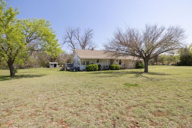 View of yard with covered porch | Image 4