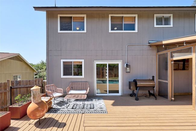 Rear view of house featuring a deck and fence | Image 28