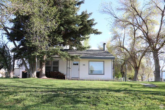 View of front of home featuring a front yard and a chimney | Image 34