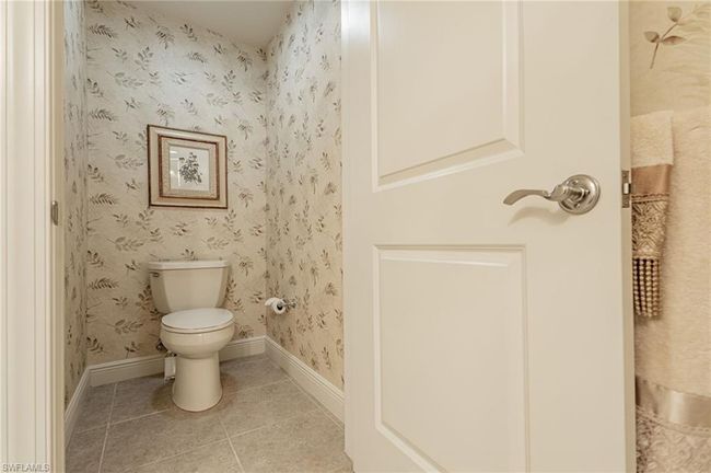 Bathroom with tile patterned flooring and toilet | Image 35