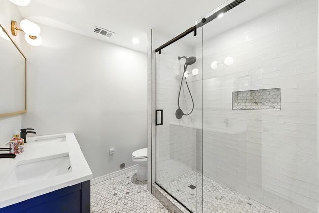 Primary en-suite bathroom with walk-in shower and double vanity | Image 28
