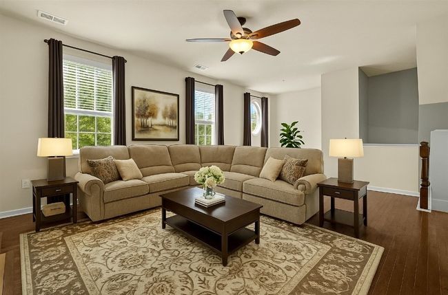A spacious living room with a beautiful hardwood flooring | Image 4