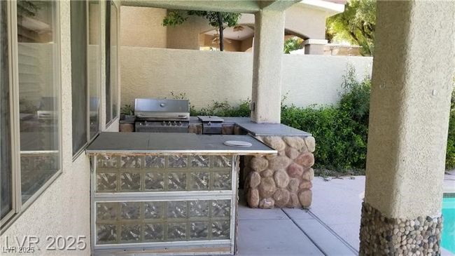 View of patio with an outdoor kitchen | Image 32