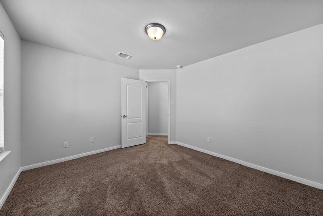 Unfurnished room featuring carpet and baseboards | Image 29