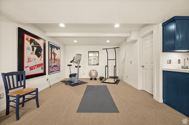 Workout room featuring recessed lighting, light carpet, and a sink | Image 25