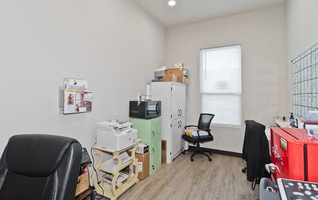 Office featuring light wood-style floors, healthy amount of natural light, and recessed lighting | Image 16