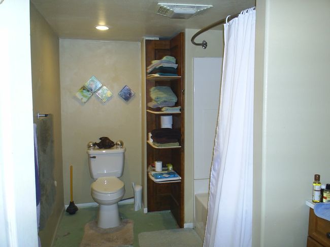 640 1/2 downstairs Bathroom with toilet and shower / bathtub combination with curtain | Image 30