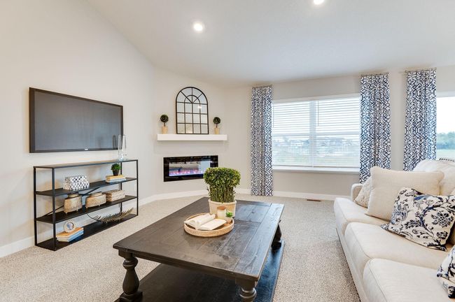 The home's main level living space is loaded with space, and can accommodate just about any family room furniture set-up. Photo of model, colors and options will vary. | Image 8