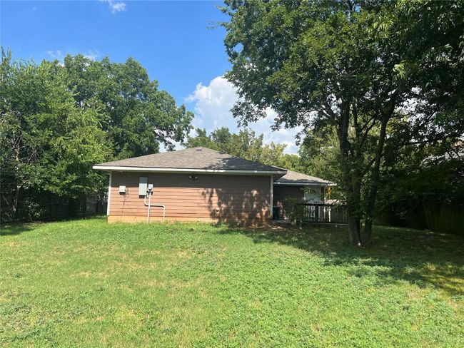 Back of property featuring a lawn and a shingled roof | Image 19