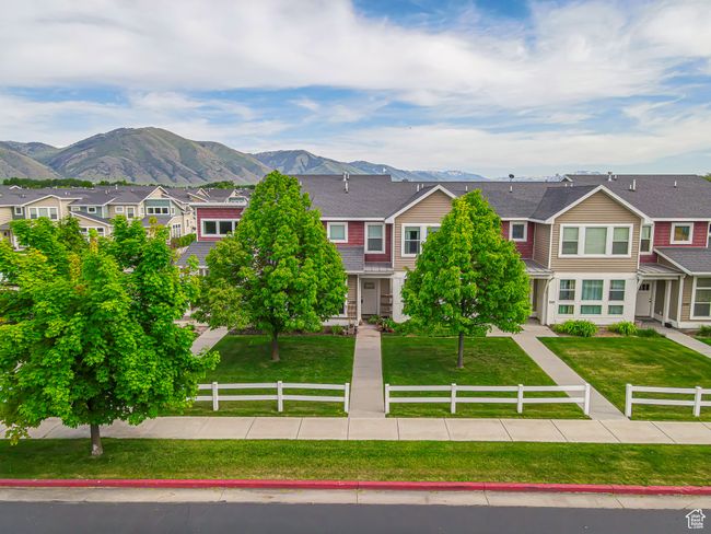 View of front of home with a residential view, a mountain view, and a shingled roof | Image 21