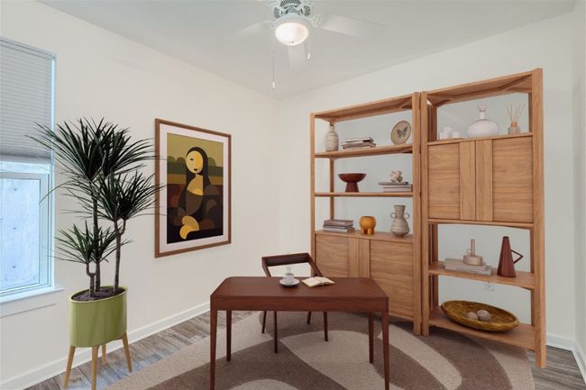The downstairs bedroom makes for a great home office for guest suite! | Image 4