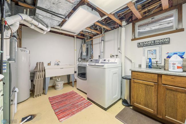 Utility/laundry - W/D included - radon mitigation system - utility sink | Image 50