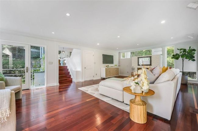 Living room featuring crown molding and dark hardwood / wood-style floors | Image 12