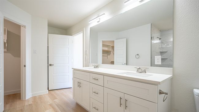 Another angle of primary bathroom. Linen storage shelves behind door | Image 21