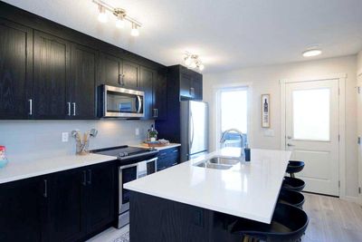 199 Vantage Dr, Home with 3 bedrooms, 2 bathrooms and 2 parking in Cochrane AB | Image 2