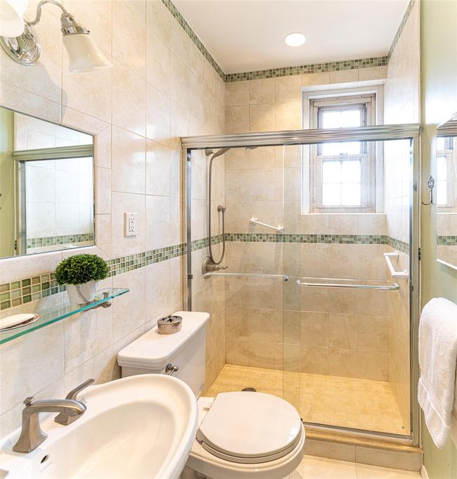 Second full hall bath with shower stall. | Image 13