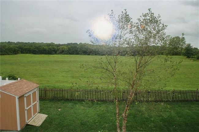 View of yard with a shed and a rural view | Image 23