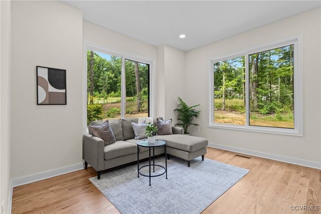 Living room with healthy amount of natural light, light wood-style flooring, and recessed lighting | Image 22