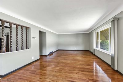 Spare room featuring hardwood / wood-style flooring | Image 3