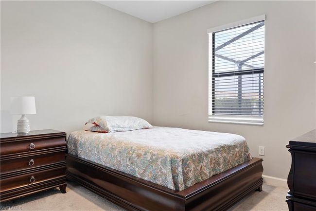 Bedroom with baseboards and light colored carpet | Image 15
