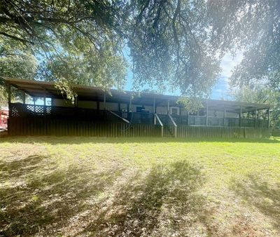 Approximately 70' of covered deck provides plenty of shaded outdoor space ~ great for gatherings, games, or peaceful relaxation. | Image 1