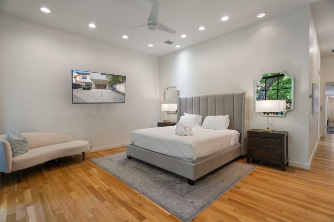 Bedroom featuring light wood-type flooring, recessed lighting, baseboards, and ceiling fan | Image 16