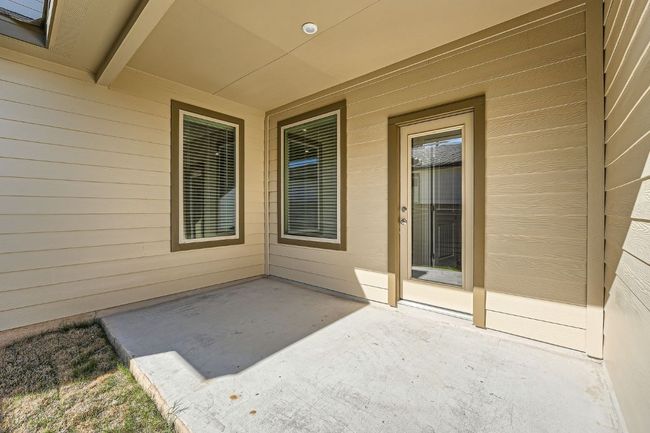 Doorway to property with a patio area | Image 25