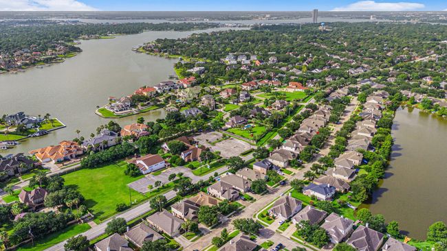 Ariel view of home with Taylor Lake and Clear Lake in background. | Image 49