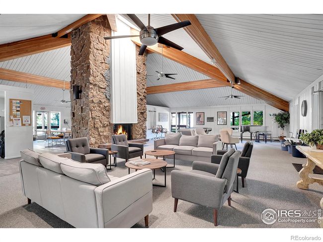 Recently updated clubhouse with large fireplace making this a perfect place to play games in the winter as you soak up the cozy fire | Image 33