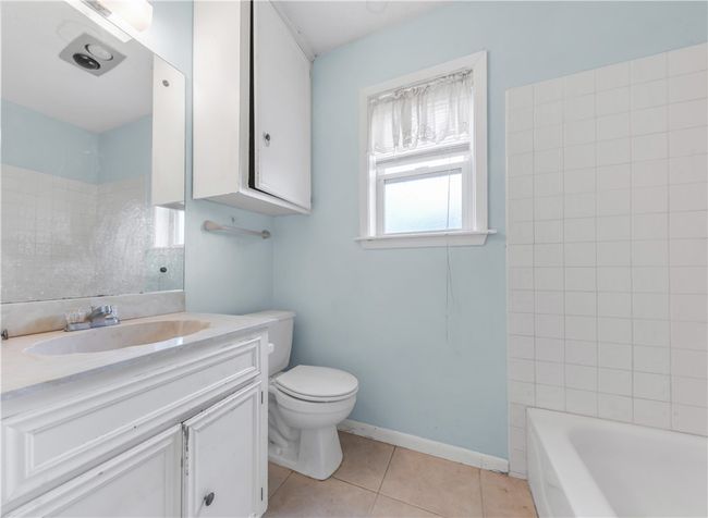 Full bath featuring vanity and tile patterned floors | Image 12