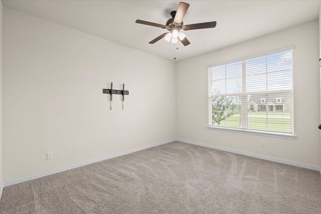 Spare room with carpet flooring and a ceiling fan | Image 22