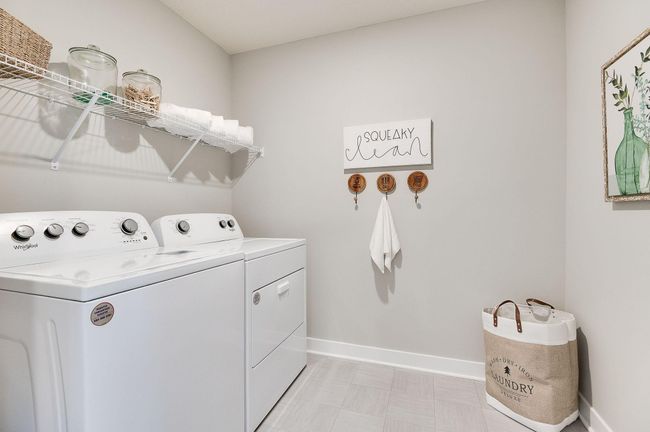 Sick of carrying laundry all over the home? Conveniently located on the upper level, this plan features the laundry room adjacent to the home’s four bedrooms. *pictures are of a model home, actual colors and finishes may vary. | Image 29