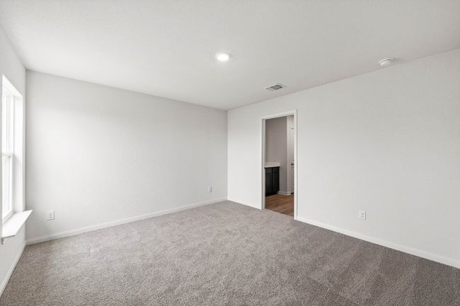 Unfurnished bedroom featuring carpet, ensuite bathroom, and recessed lighting | Image 6
