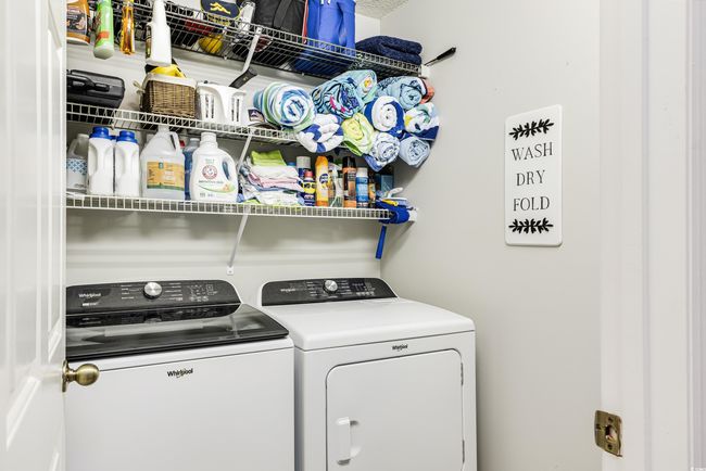 Washroom featuring washing machine and dryer and laundry area | Image 19