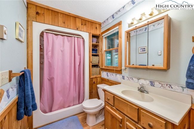 The primary ensuite full bath has an easy step-in shower. | Image 14