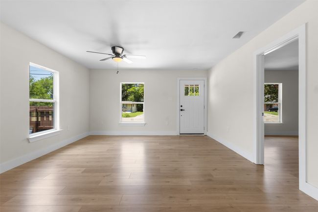 Foyer with a ceiling fan, plenty of natural light, and light wood-type flooring | Image 9