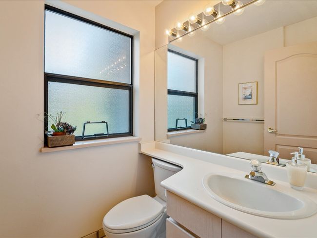 Half bath featuring vanity and toilet | Image 25