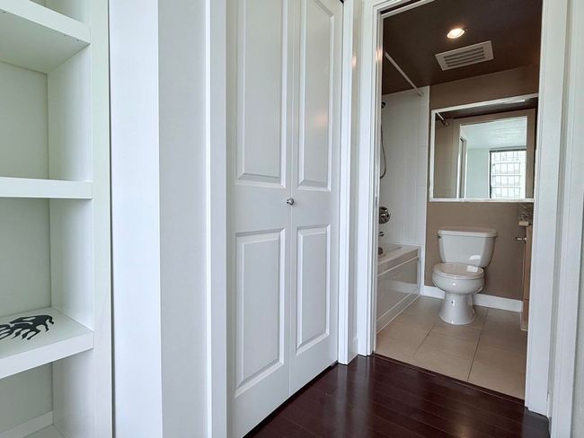 Full bath featuring tub / shower combination and wood finished floors | Image 19