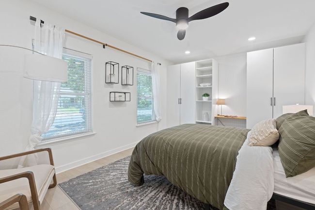 Bedroom featuring recessed lighting, a ceiling fan, and light wood-style flooring | Image 25