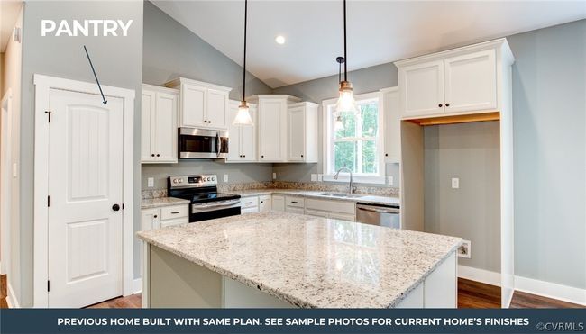 Kitchen featuring appliances with stainless steel finishes, white cabinets, high vaulted ceiling, light hardwood / wood-style floors, and hanging light fixtures | Image 7