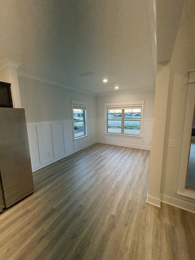 STOCK PHOTO. SELECTIONS WILL VARY IN ACTUAL HOUSE. Breakfast area w/ craftsman trim and wainscoting. | Image 9