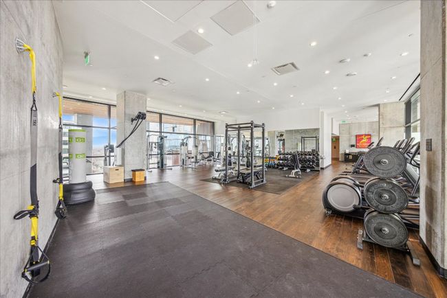 Workout area with recessed lighting, visible vents, and wood finished floors | Image 25