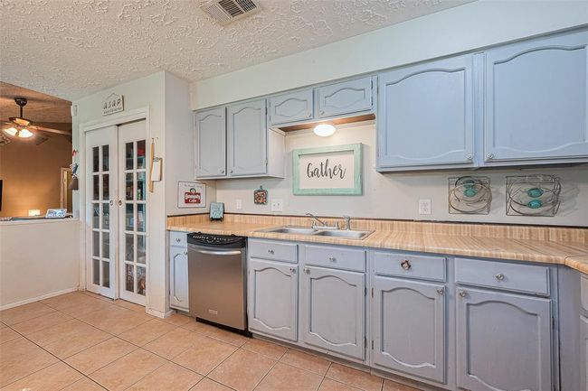 Adjacent view of recently painted cabinets. | Image 11