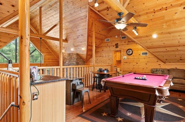 Playroom featuring light wood-style floors, wooden ceiling, ceiling fan, wood walls, and billiards | Image 26